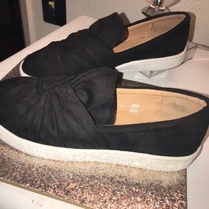 Black knot slip on shoes